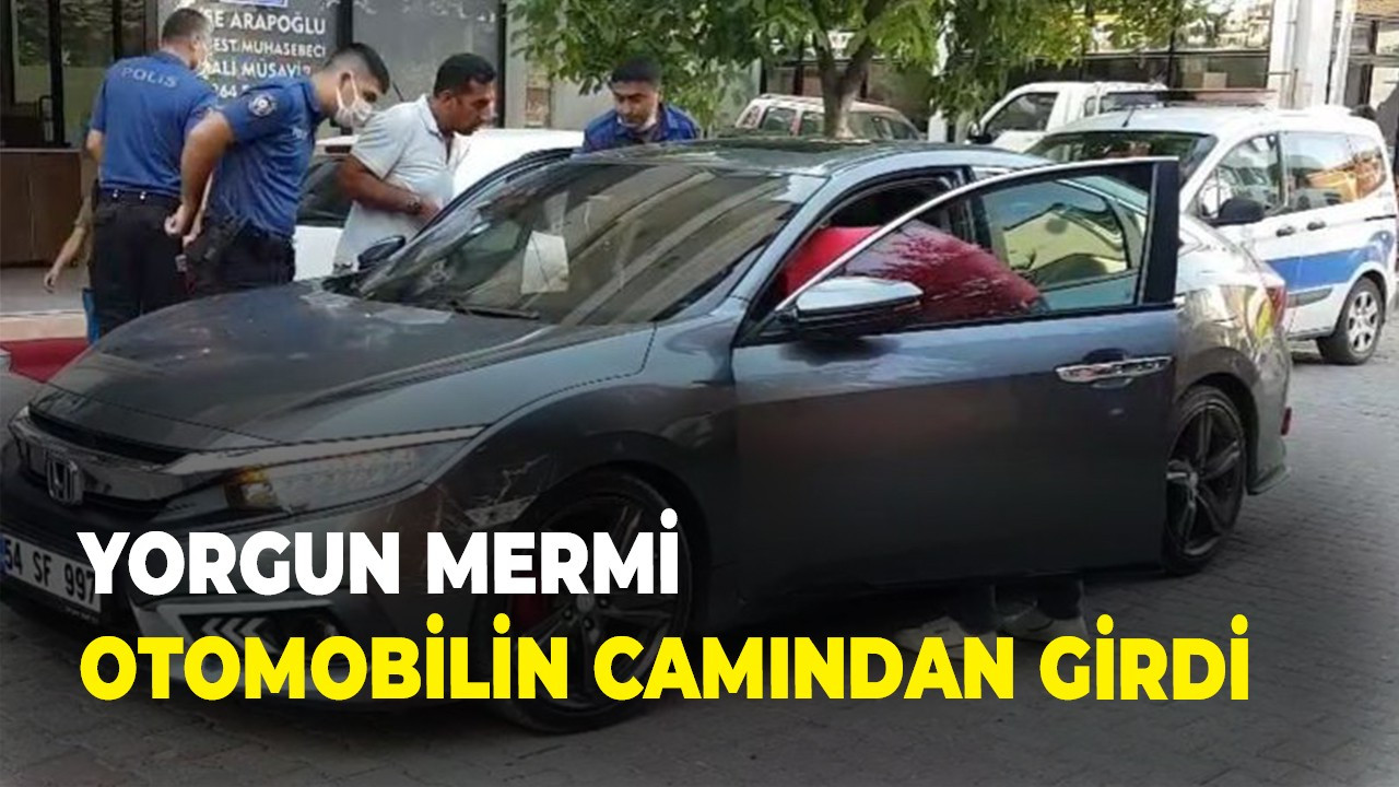 Yorgun mermi otomobilin camından girdi