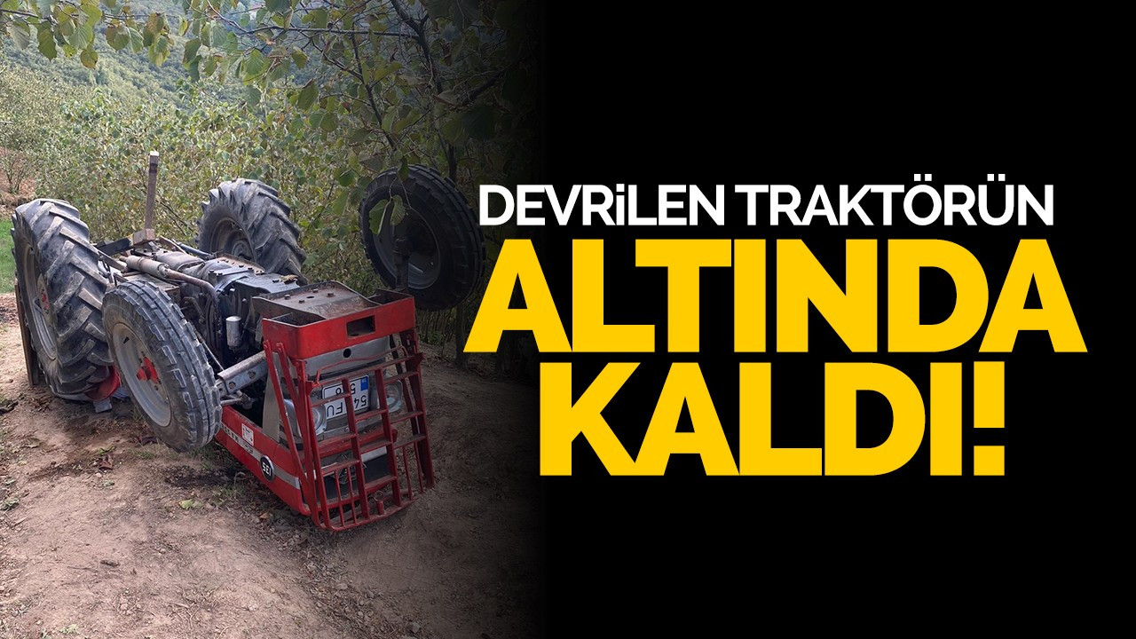 Devrilen traktörün altında kaldı!