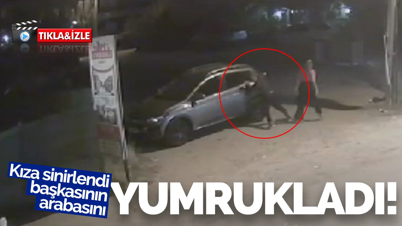 Kıza sinirlendi, başkasının aracını yumrukladı